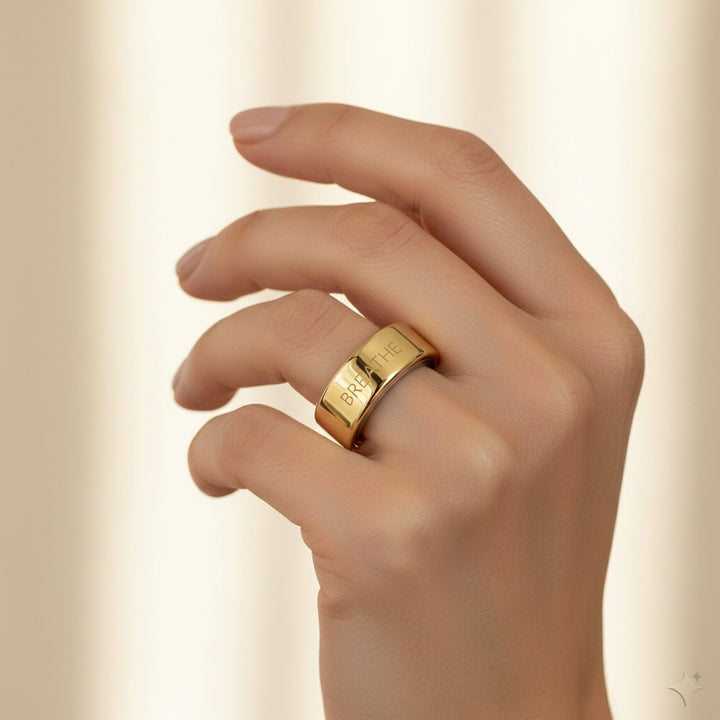 BREATHE engraved 14K Yellow Gold Oura Ring cover worn on hand