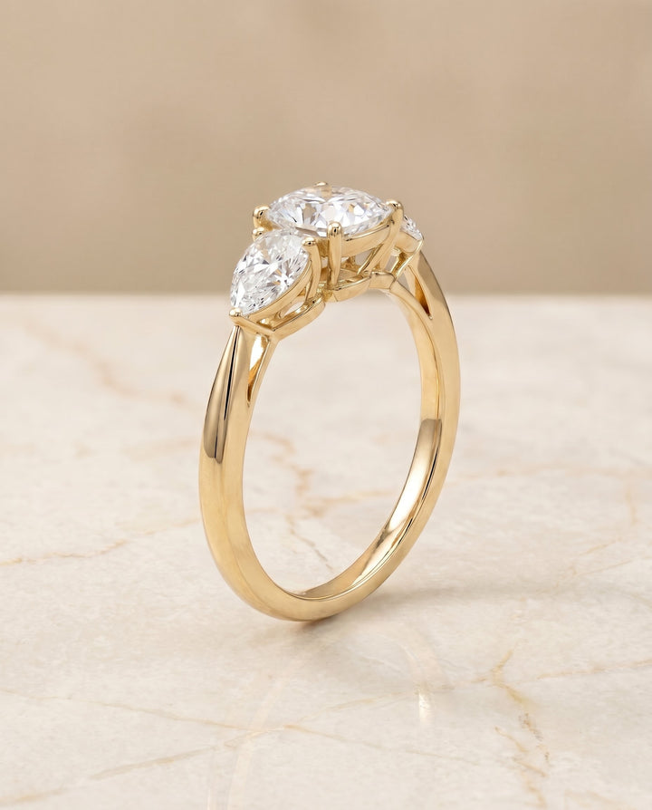 แหวนหมั้นประดับเพชร Angelica Three Stone แบบ Cushion Cut ตัวเรือนทอง 18K