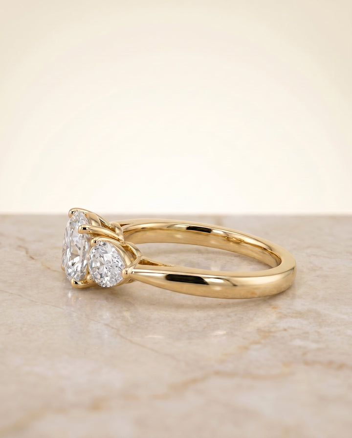 แหวนหมั้นประดับเพชร Angelica Three Stone แบบ Cushion Cut ตัวเรือนทอง 18K