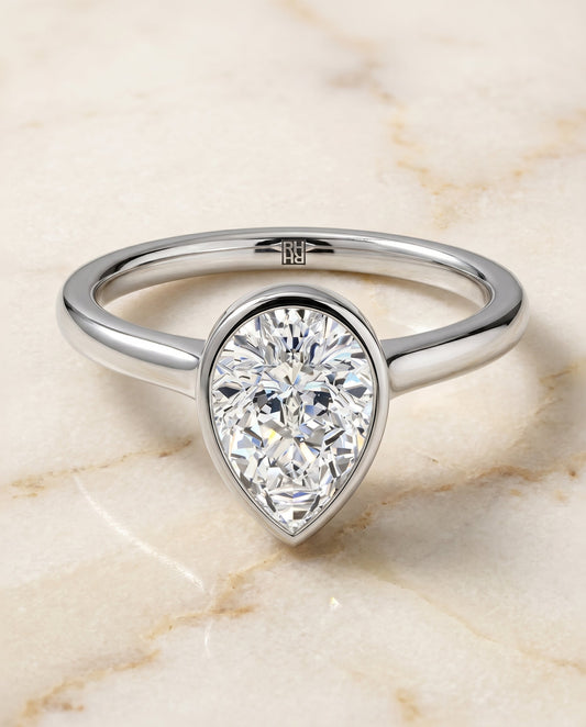 Duran Select Simple Bezel Solitaire Pear Shape in Platinum – view 1