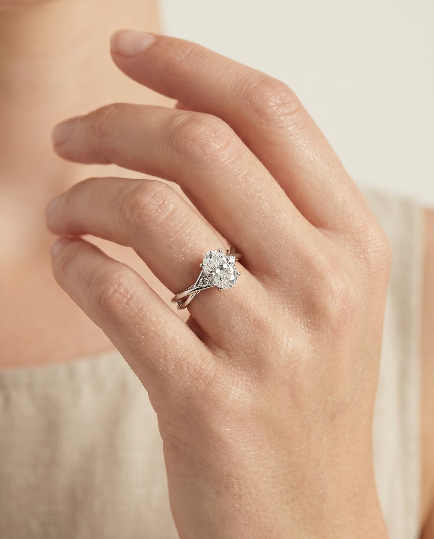 Dusty Select Twisted Shank Hidden Halo Solitaire Oval in 18K White Gold – view 3