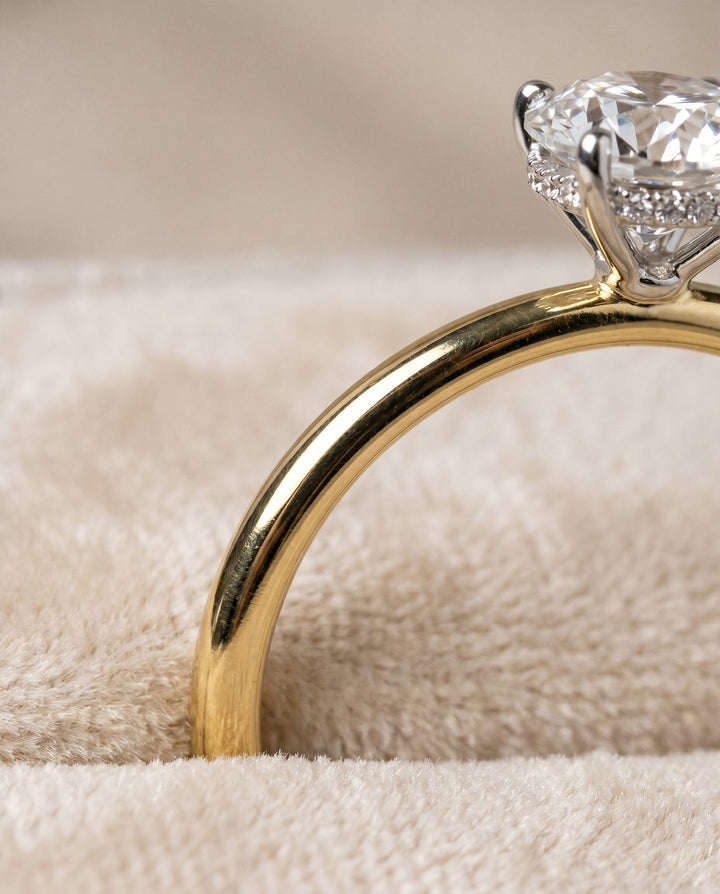 The Eartha Hidden Halo Solitaire Engagement Ring Setting for Round Diamonds in 18K Yellow Gold