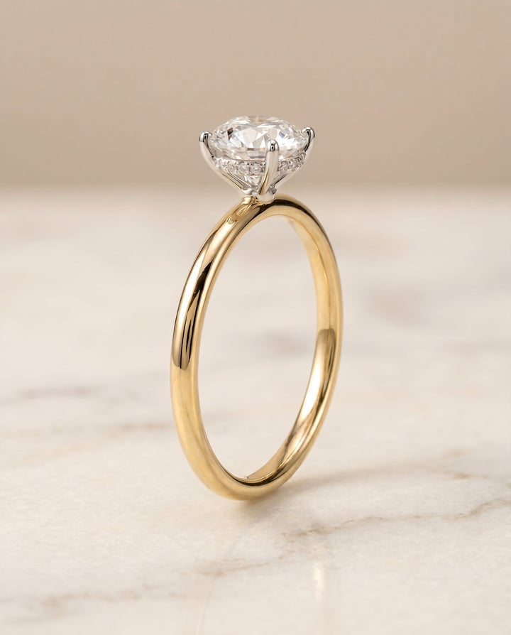 The Eartha Hidden Halo Solitaire Engagement Ring Setting for Round Diamonds in 18K Yellow Gold