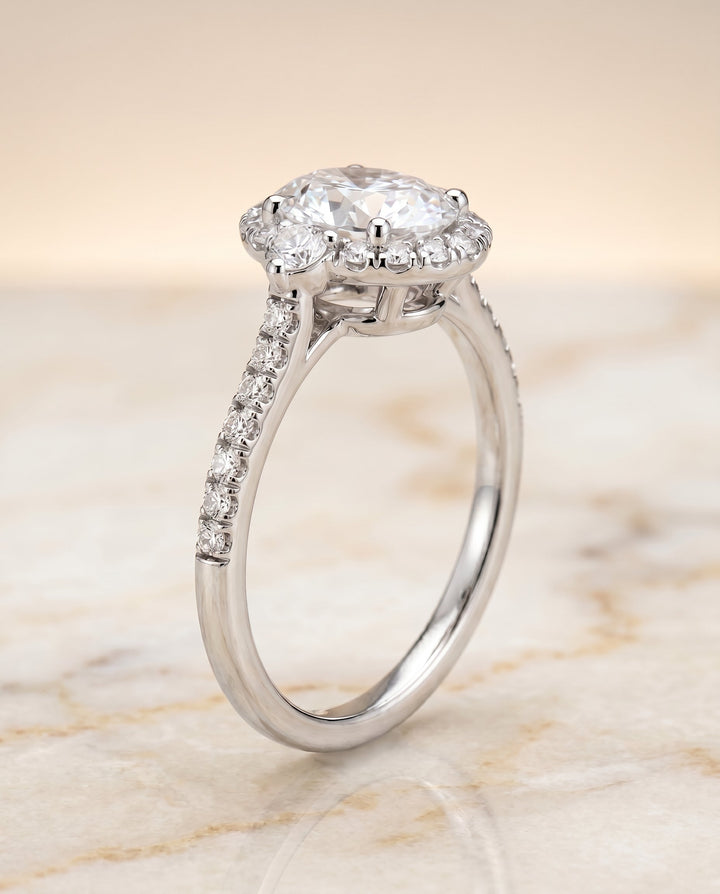 Three Stone Delicate Halo Oval, in Platinum – front view | RockHer