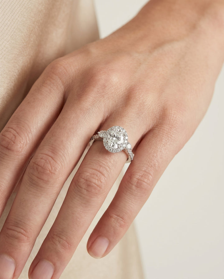 Three Stone Delicate Halo Oval, in Platinum – lifestyle shot | RockHer