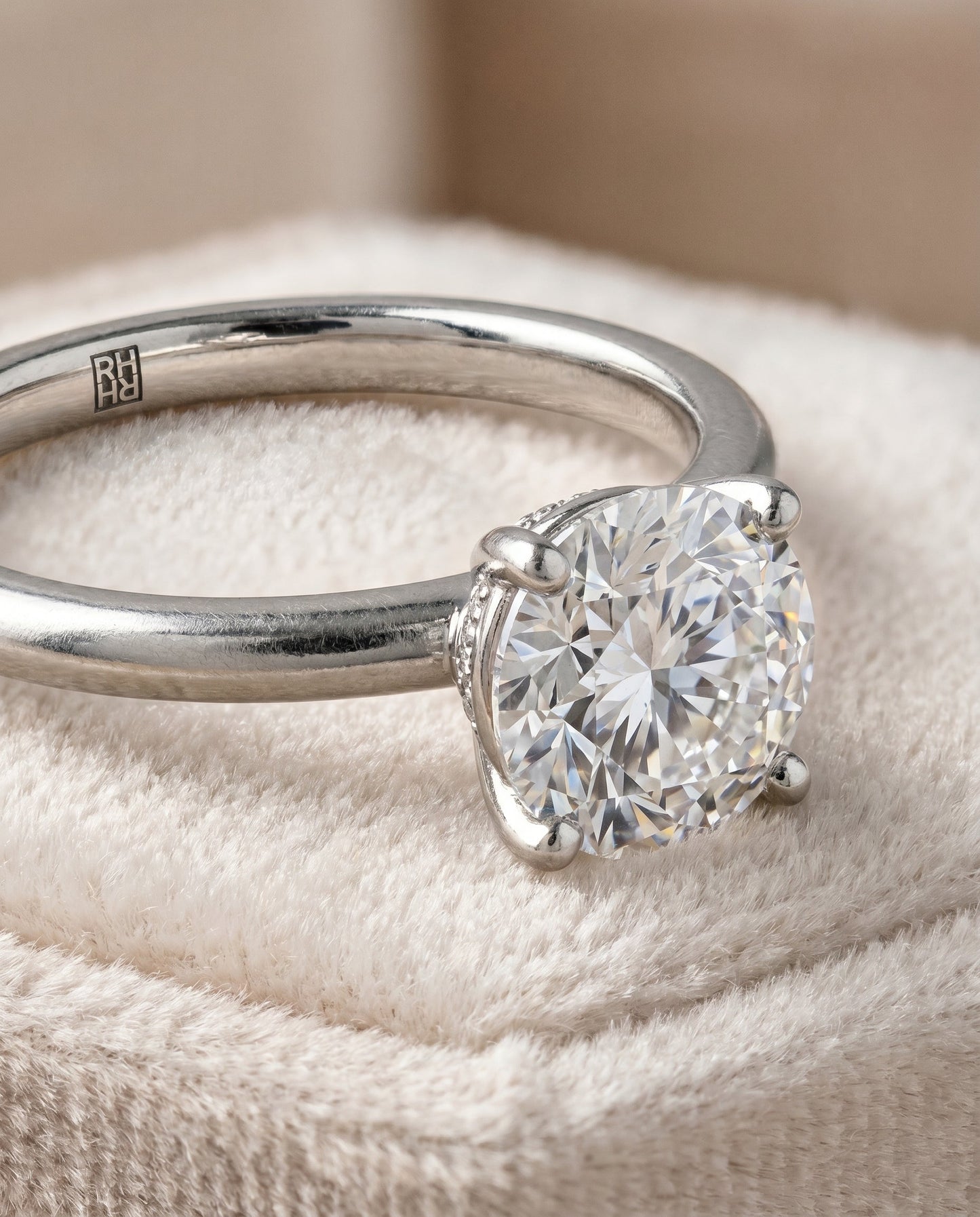 The Joni Hidden Halo Solitaire Engagement Ring Setting for Round Diamonds in Platinum