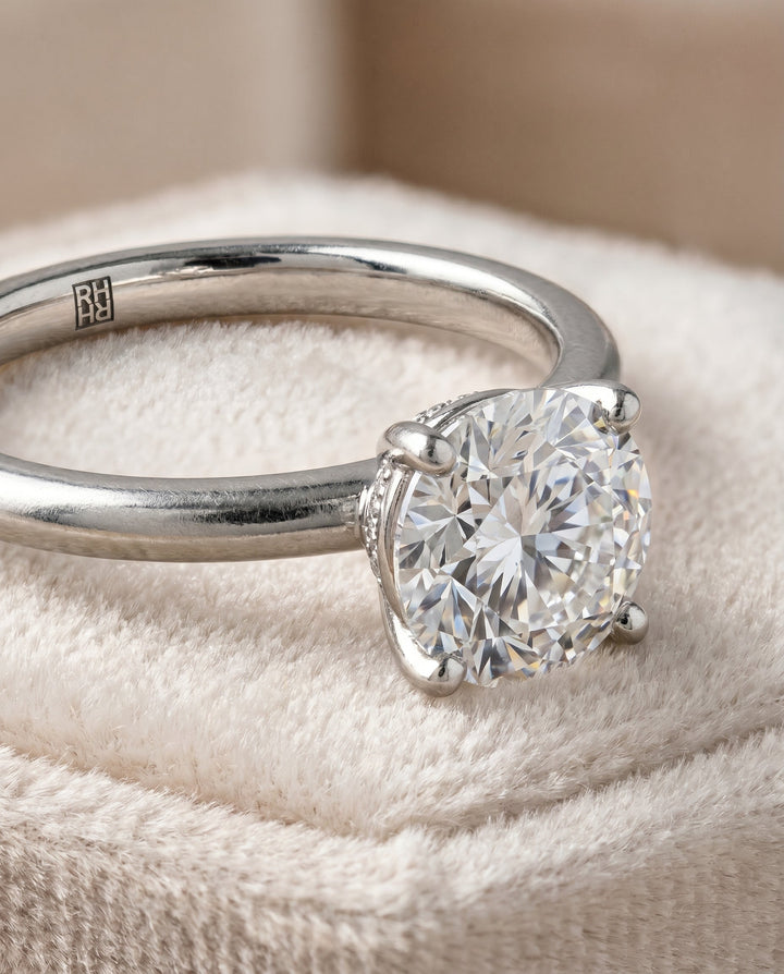 The Joni Hidden Halo Solitaire Engagement Ring Setting for Round Diamonds in Platinum
