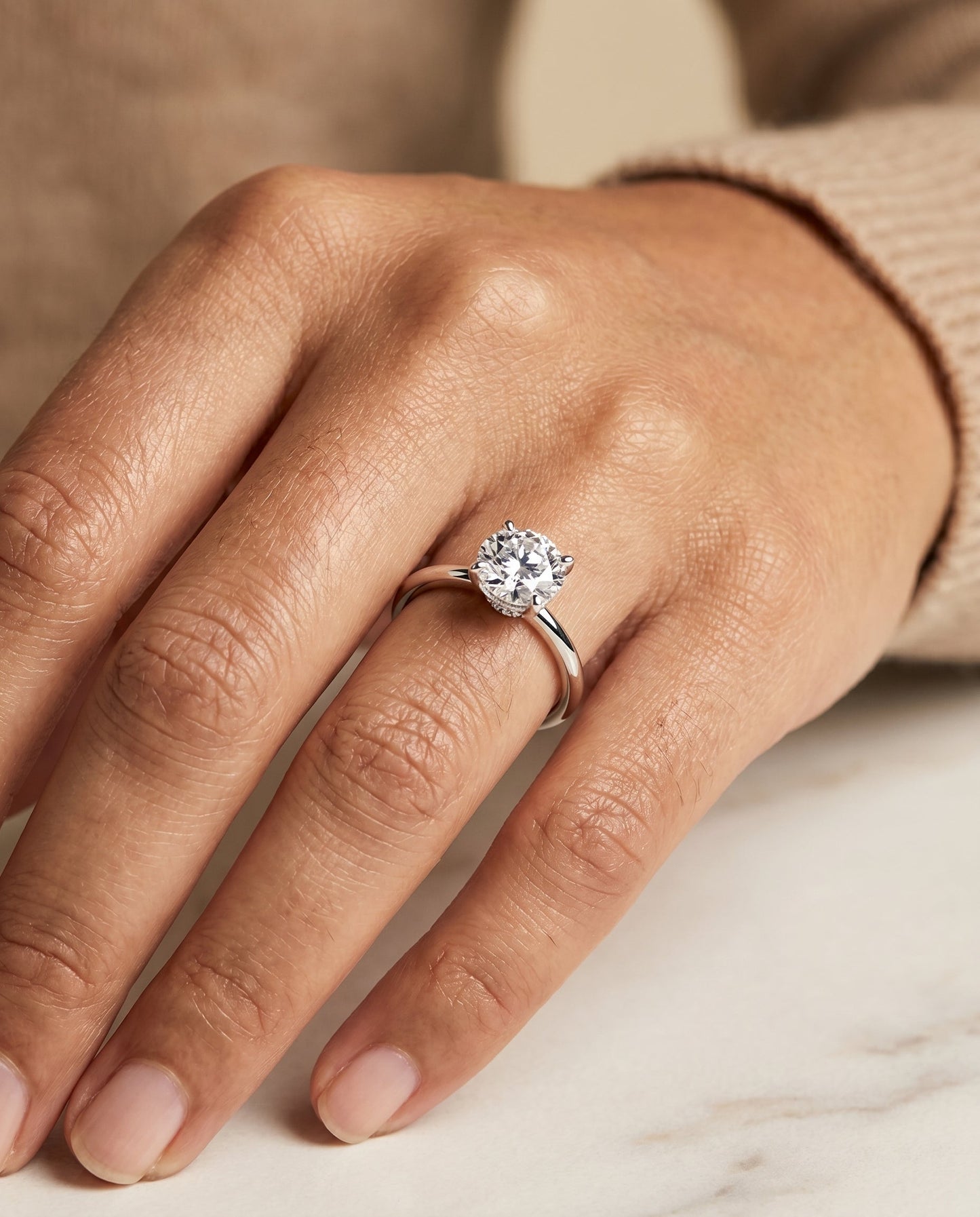 The Joni Hidden Halo Solitaire Engagement Ring Setting for Round Diamonds in Platinum