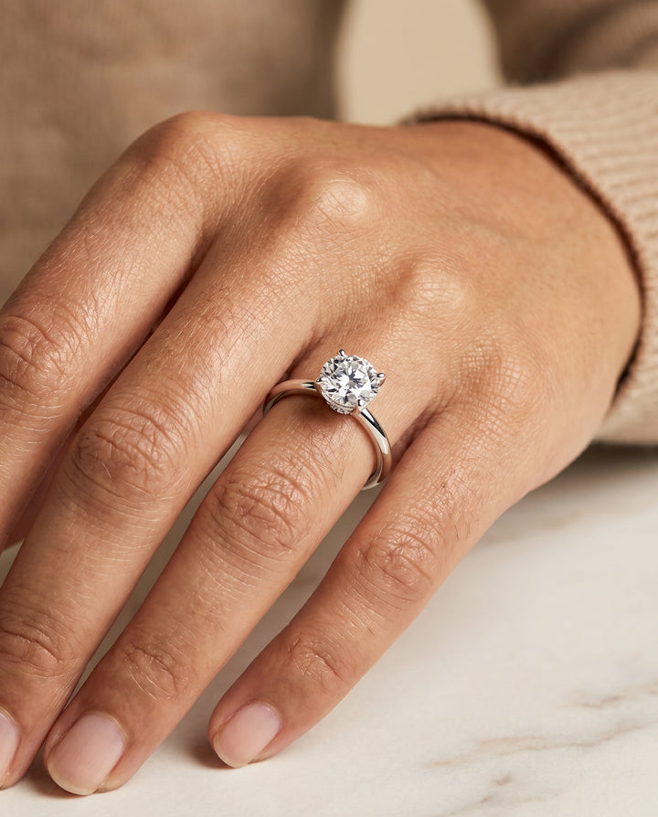 The Joni Hidden Halo Solitaire Engagement Ring Setting for Round Diamonds in Platinum