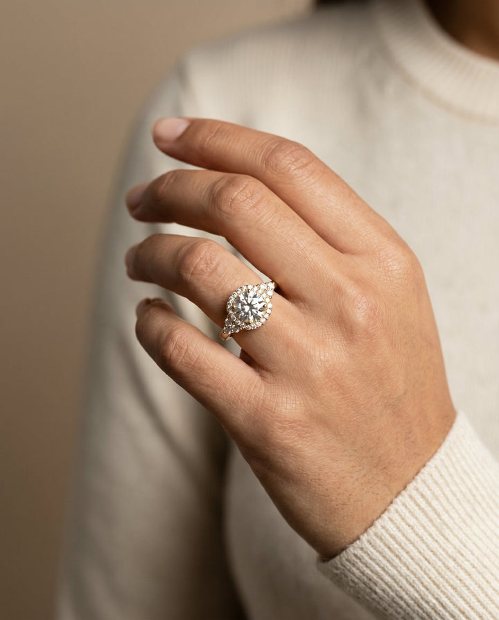 Round Brilliant, Open Twisted Triple Halo, in 18K Yellow Gold, pave setting – lifestyle shot | RockHer