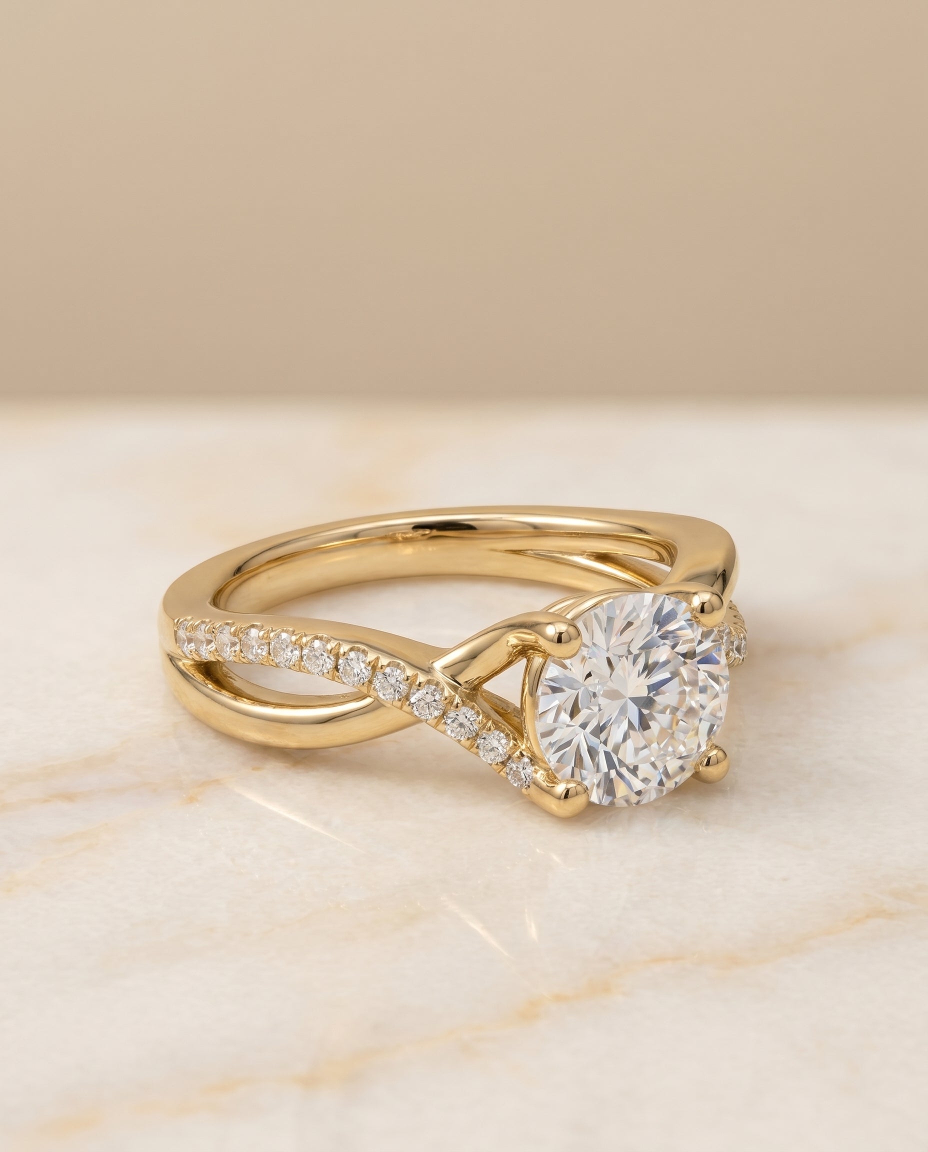 Round Brilliant, Bypass Pavé Twist, in 18K Yellow Gold, pave setting – angled view | RockHer