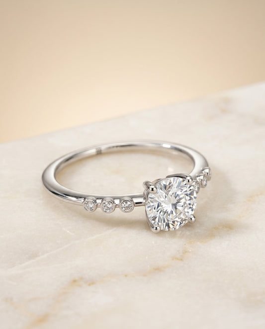 Peggy Select Bezel Accent Solitaire Emerald Cut in 18K White Gold – view 1