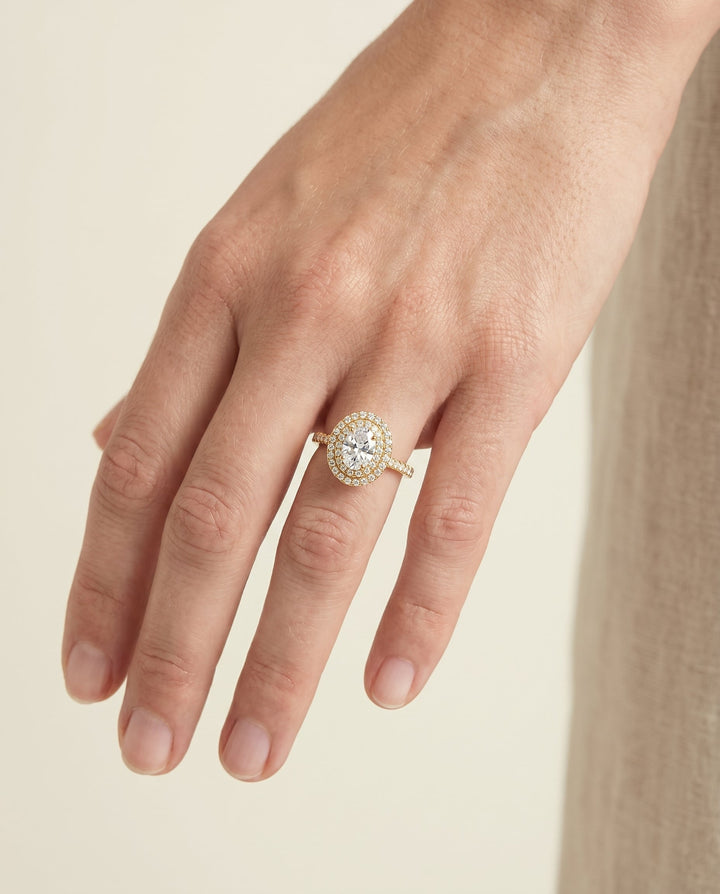 The Whitney Pavé Halo Engagement Ring Setting for Oval Diamonds in 18K Yellow Gold