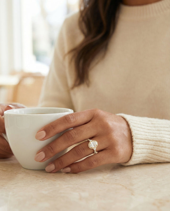 Three Stone Delicate Halo Oval, in 18K Yellow Gold – lifestyle shot | RockHer
