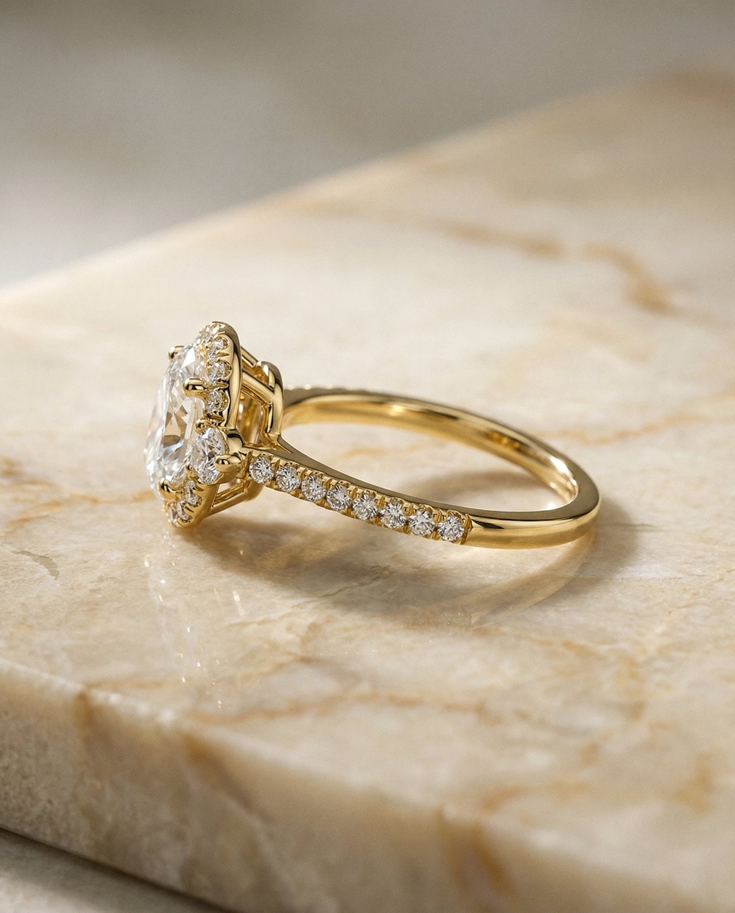 Ivy Select three stone delicate halo oval oval ring in 14K Yellow Gold — side — RockHer
