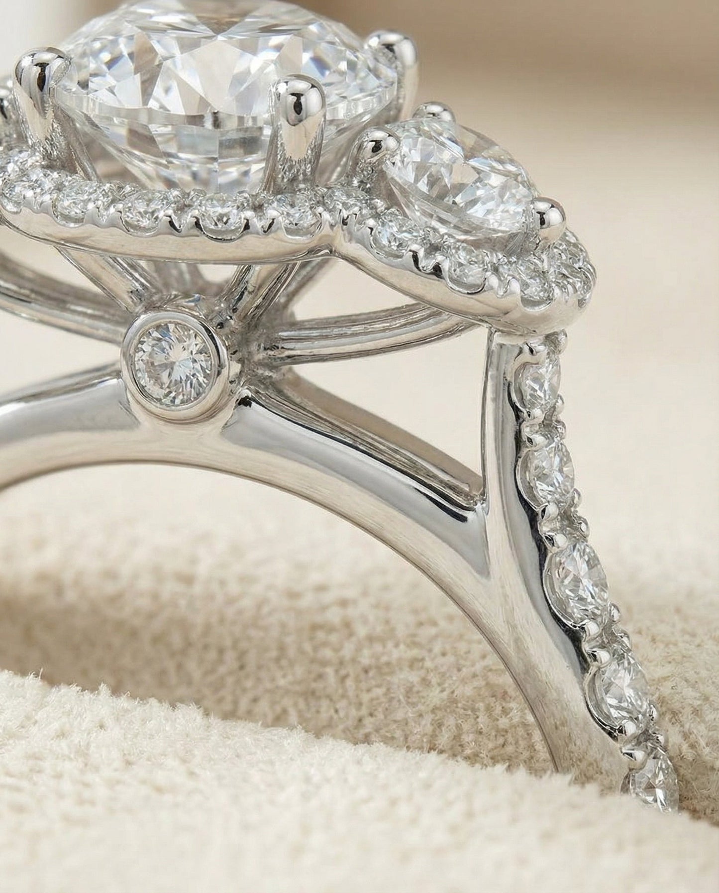 Round Brilliant, Three Stone Halo, in Platinum, pave setting – detail view | RockHer