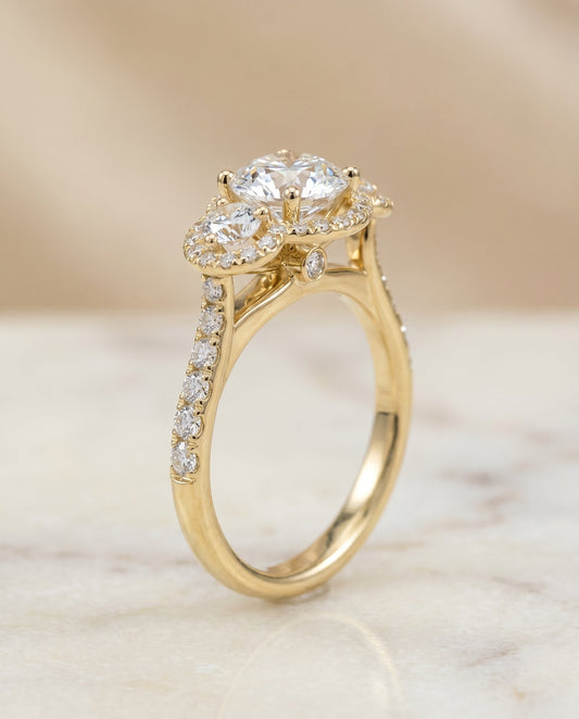 Round Brilliant, Three Stone Halo, in 18K Yellow Gold, pave setting – front view | RockHer