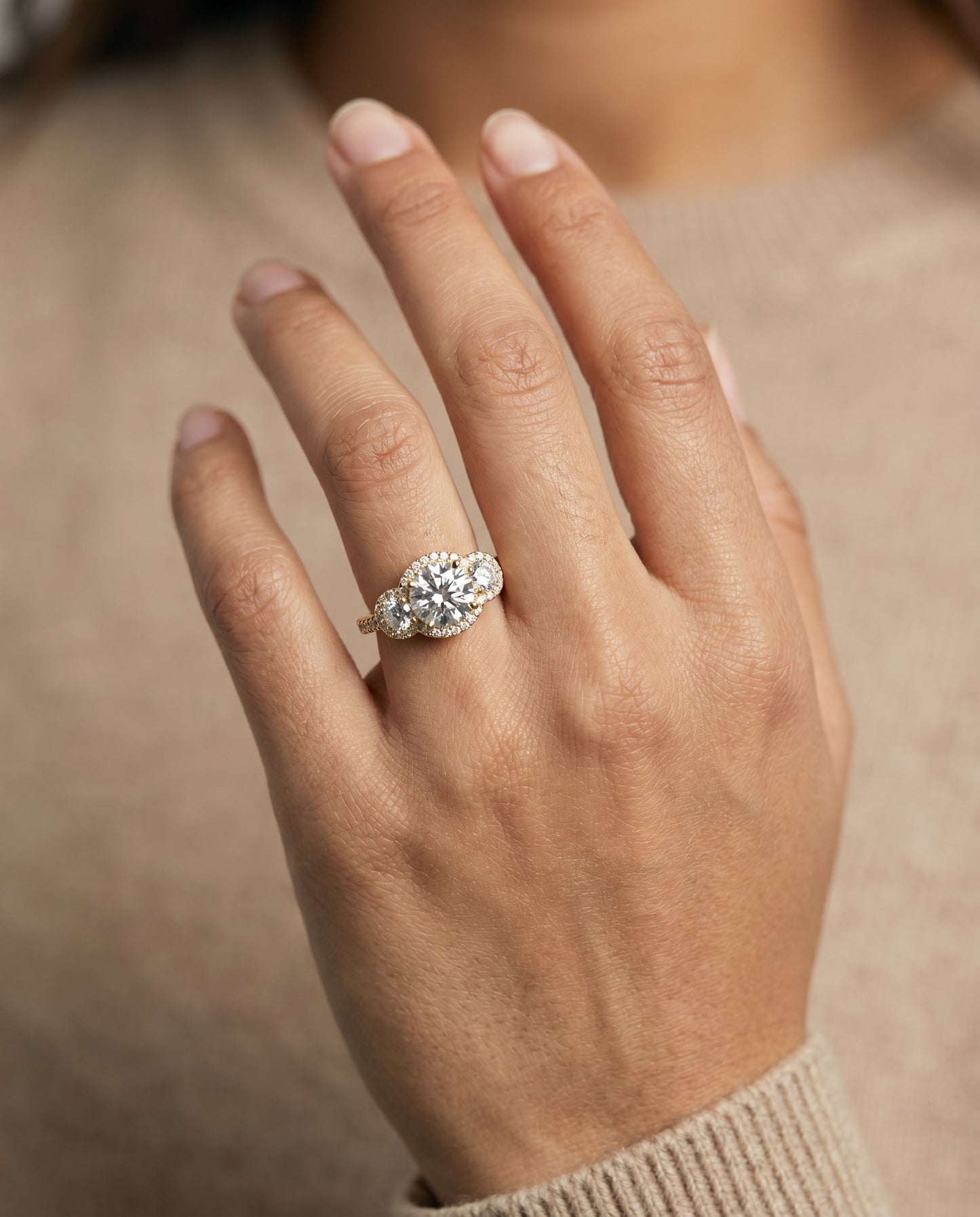 Round Brilliant, Three Stone Halo, in 18K Yellow Gold, pave setting – lifestyle shot | RockHer