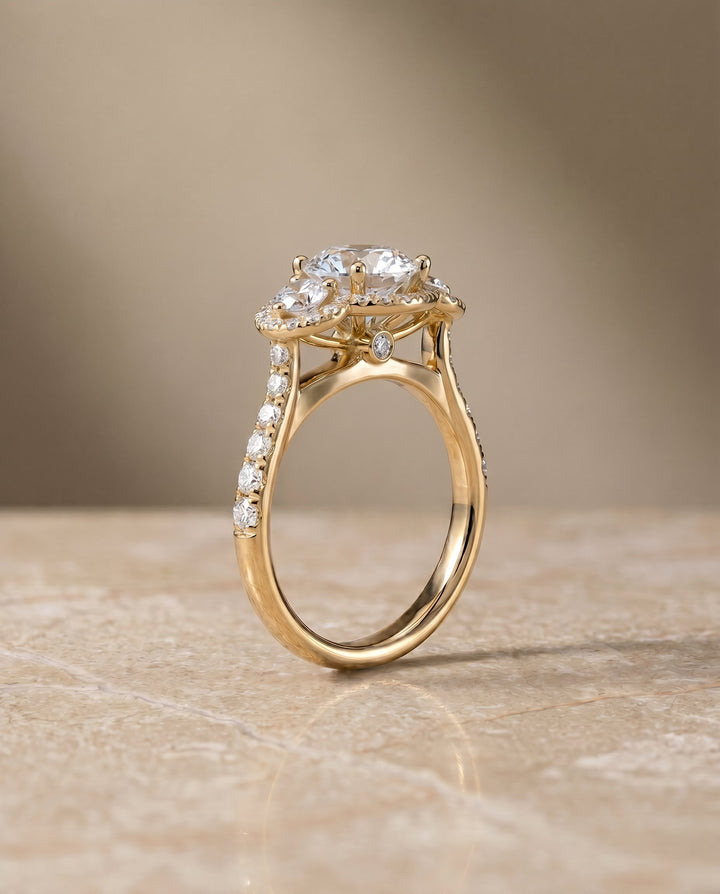 Round Brilliant, Three Stone Halo, in 18K Yellow Gold, pave setting – side profile | RockHer