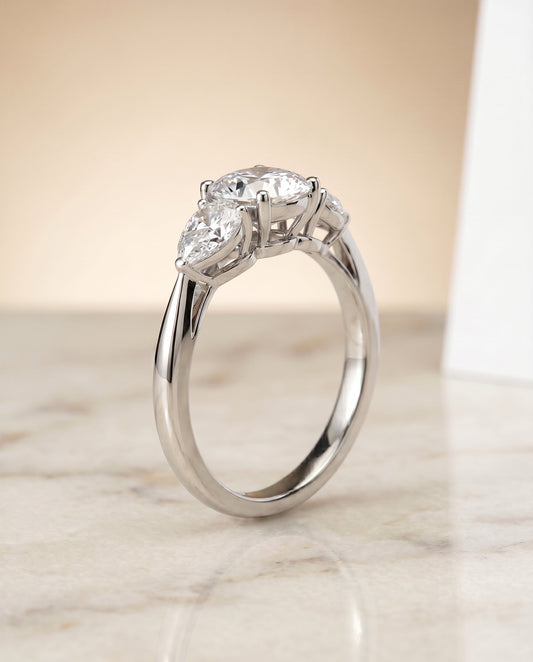 Angelica Select Three Stone Matched Shape Cushion Solitaire in Platinum – view 1