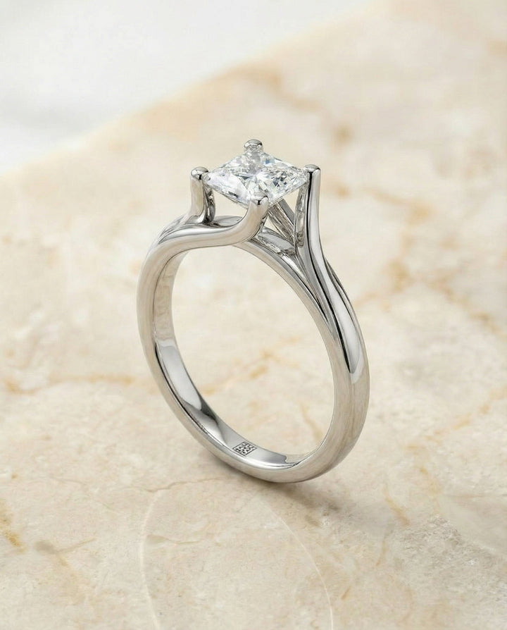 Twisted Bypass Solitaire Princess, in Platinum – angled view | RockHer