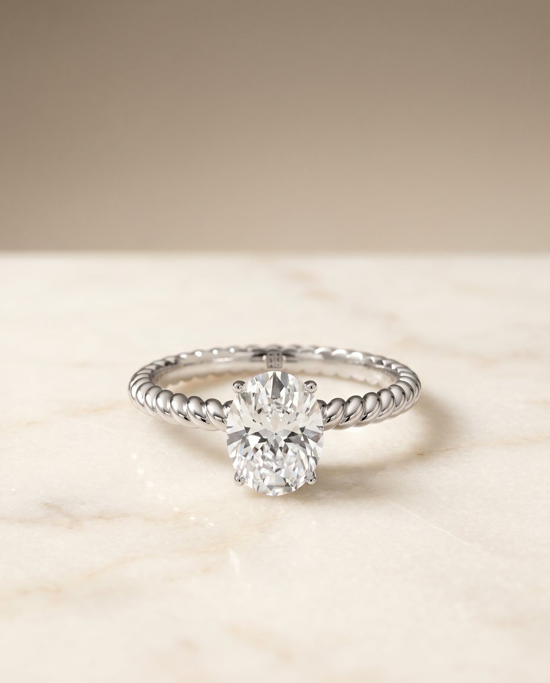 Oval, Twisted Rope Surprise Stone Solitaire, in 18K White Gold – angled view | RockHer