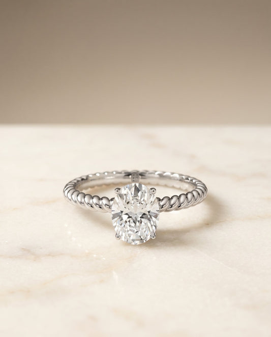 Oval, Twisted Rope Surprise Stone Solitaire, in 18K White Gold – angled view | RockHer
