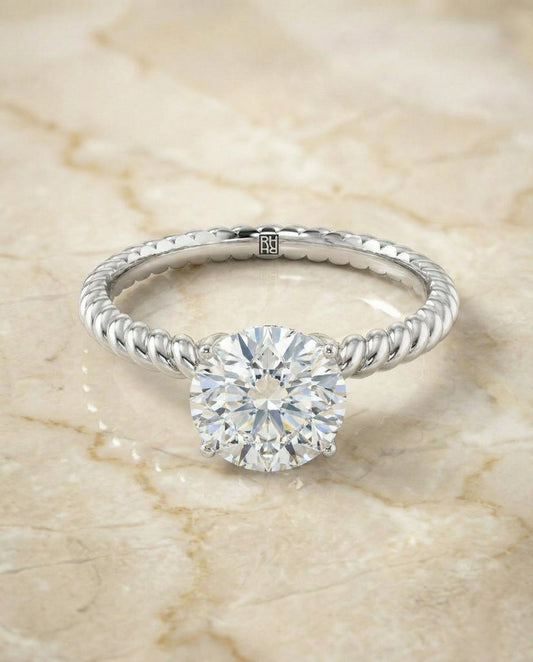 Round Brilliant, Twisted Rope Surprise Stone Solitaire, in Platinum – angled view | RockHer