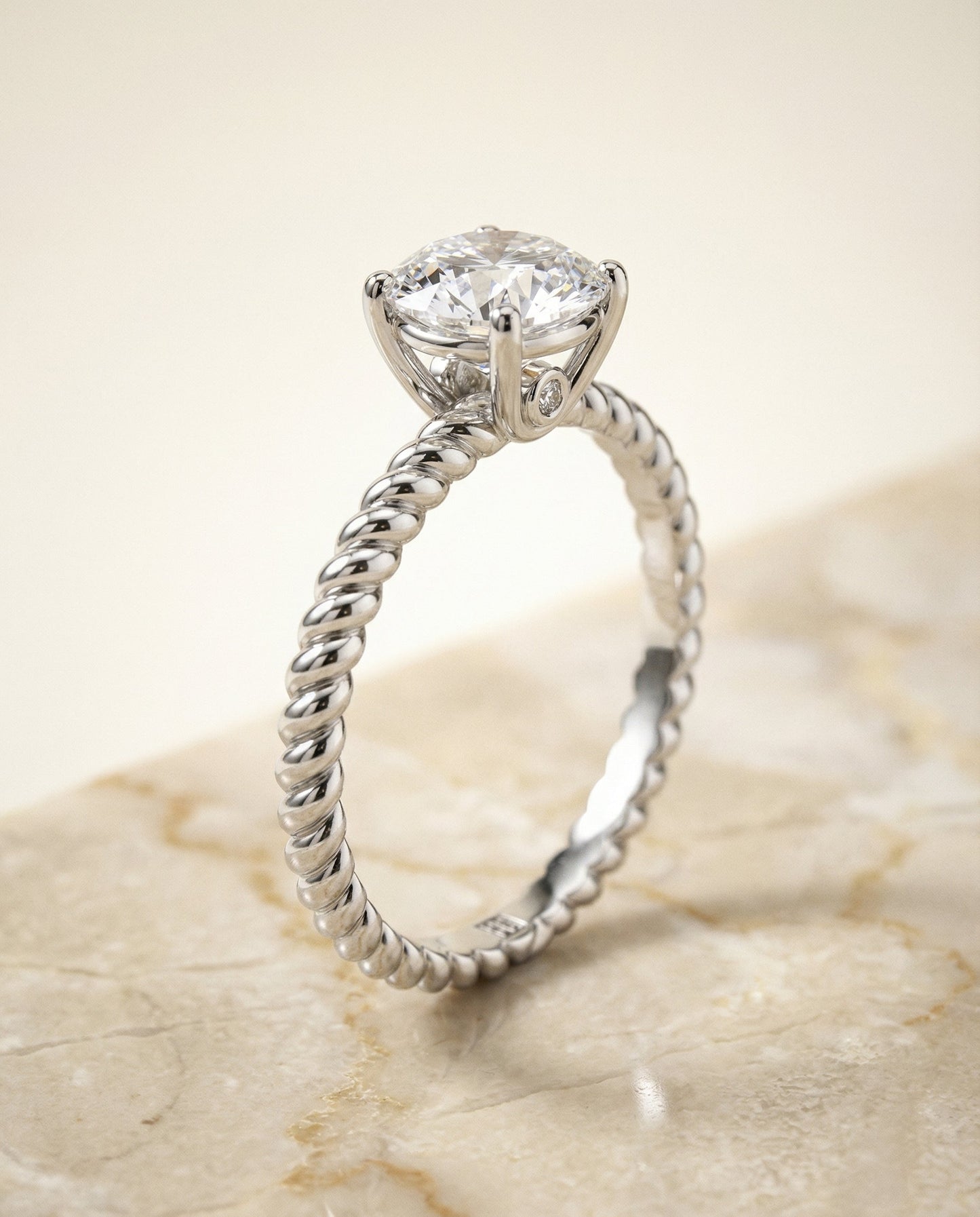 Round Brilliant, Twisted Rope Surprise Stone Solitaire, in Platinum – front view | RockHer