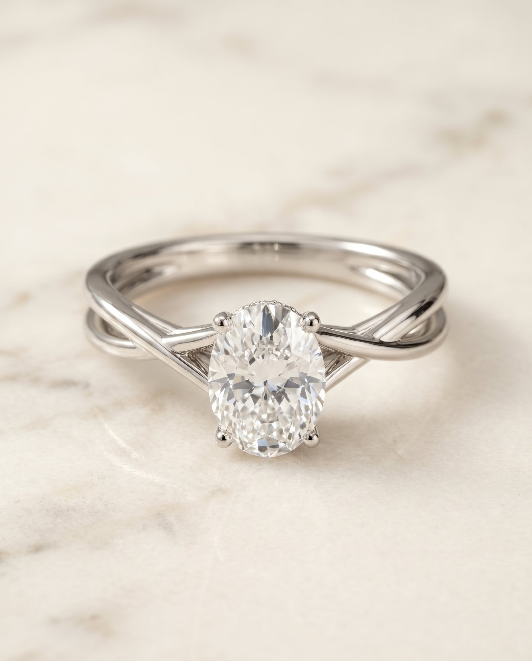 The Blondie Twisted Hidden Halo Solitaire Engagement Ring Setting for Oval Diamonds in Platinum | RockHer