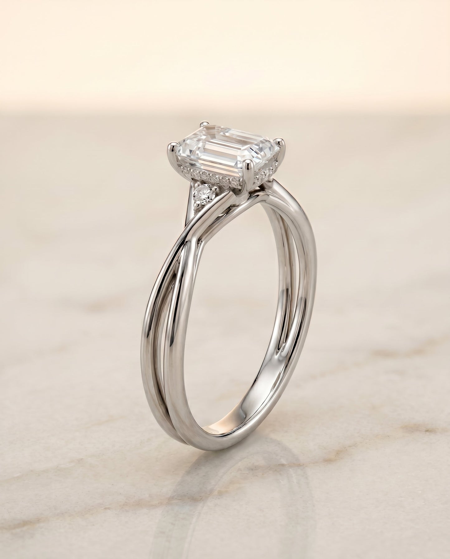 The Dusty Twisted Hidden Halo Solitaire Engagement Ring Setting for Emerald Cut Diamonds in Platinum | RockHer