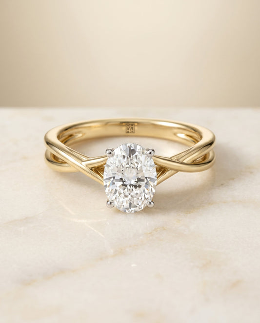 The Grace Twisted Hidden Halo Solitaire Engagement Ring Setting for Oval Diamonds in 18K Yellow Gold | RockHer