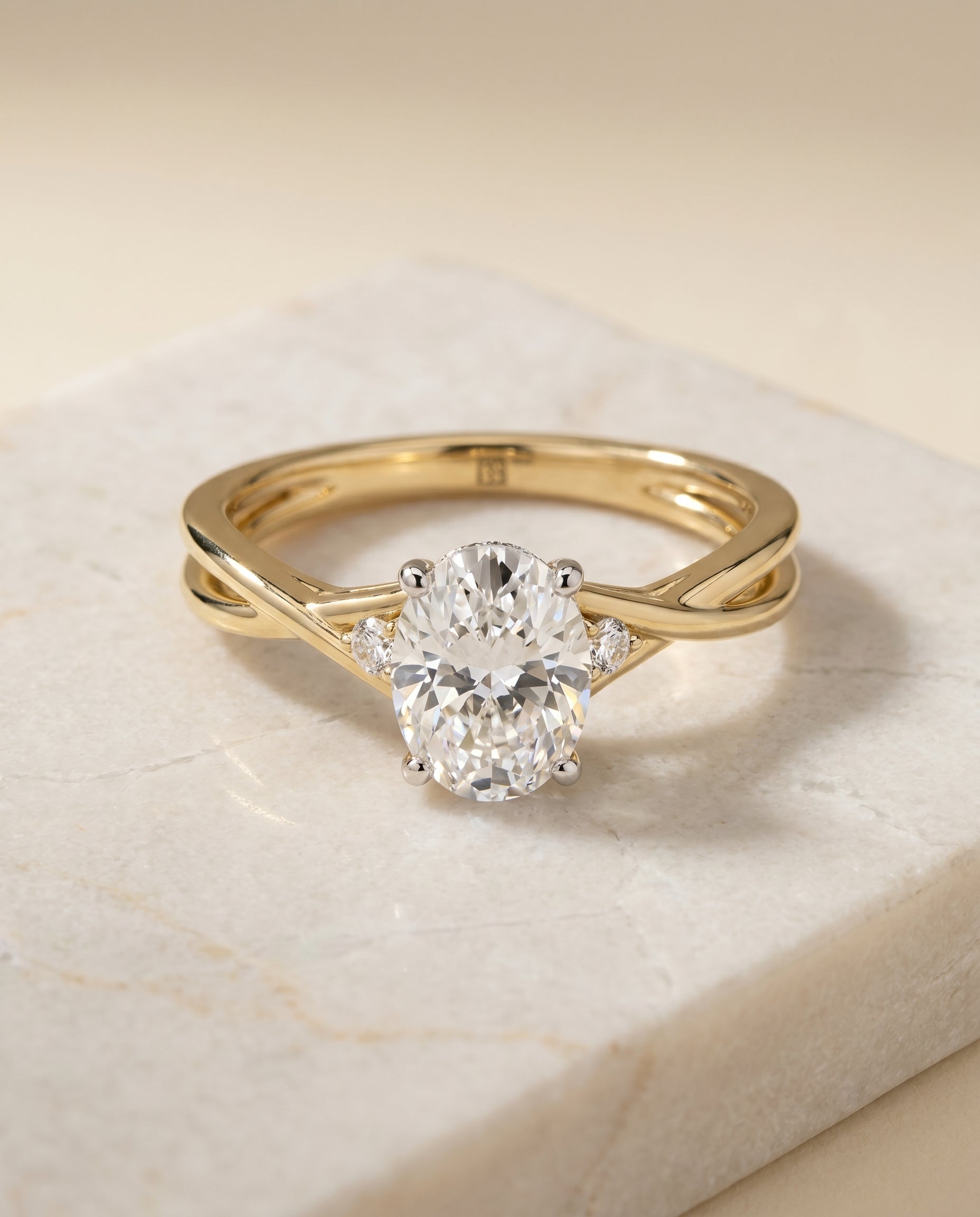 Dusty Select Twisted Shank Hidden Halo Solitaire Oval in 14K Yellow Gold – view 1