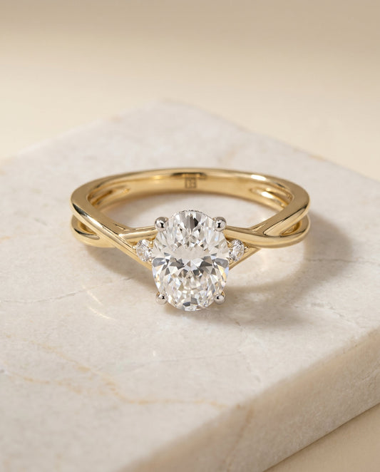 Dusty Select Twisted Shank Hidden Halo Solitaire Oval in 14K Yellow Gold – view 1