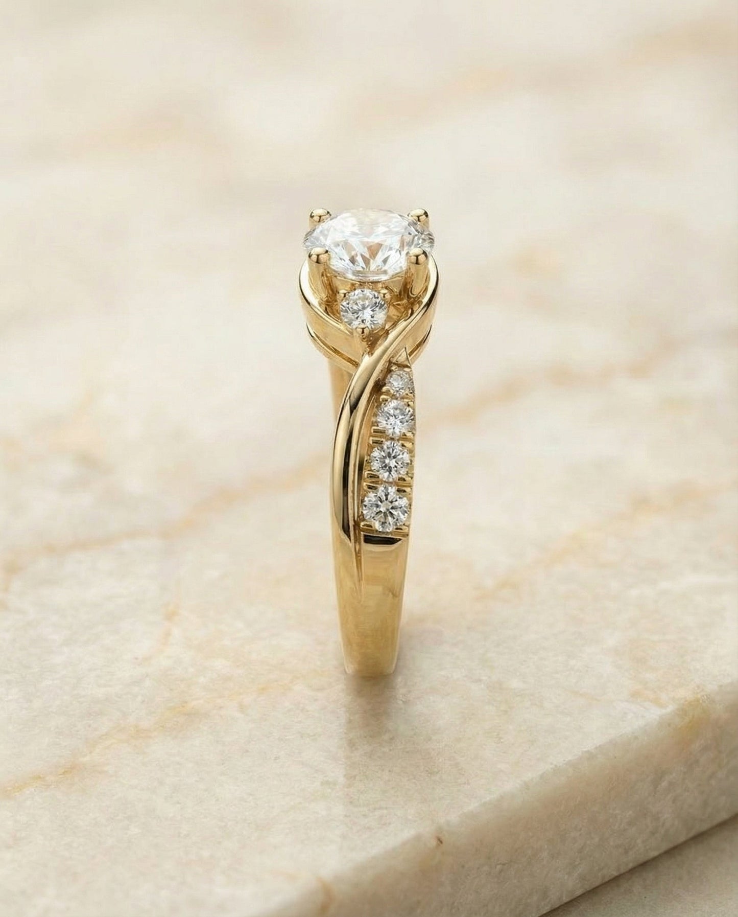 Round Brilliant, Twisted Three Stone, in 18K Yellow Gold – side profile | RockHer