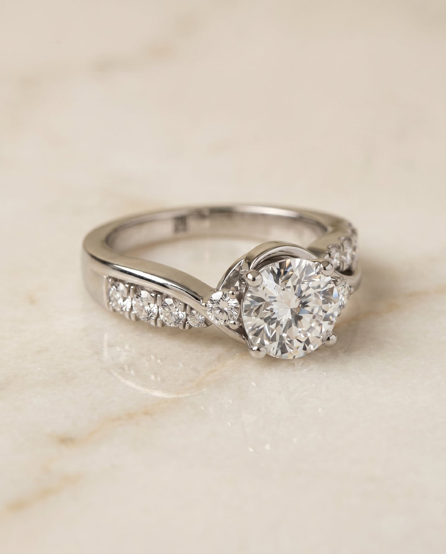 Round Brilliant, Twisted Three Stone, in 18K White Gold – angled view | RockHer