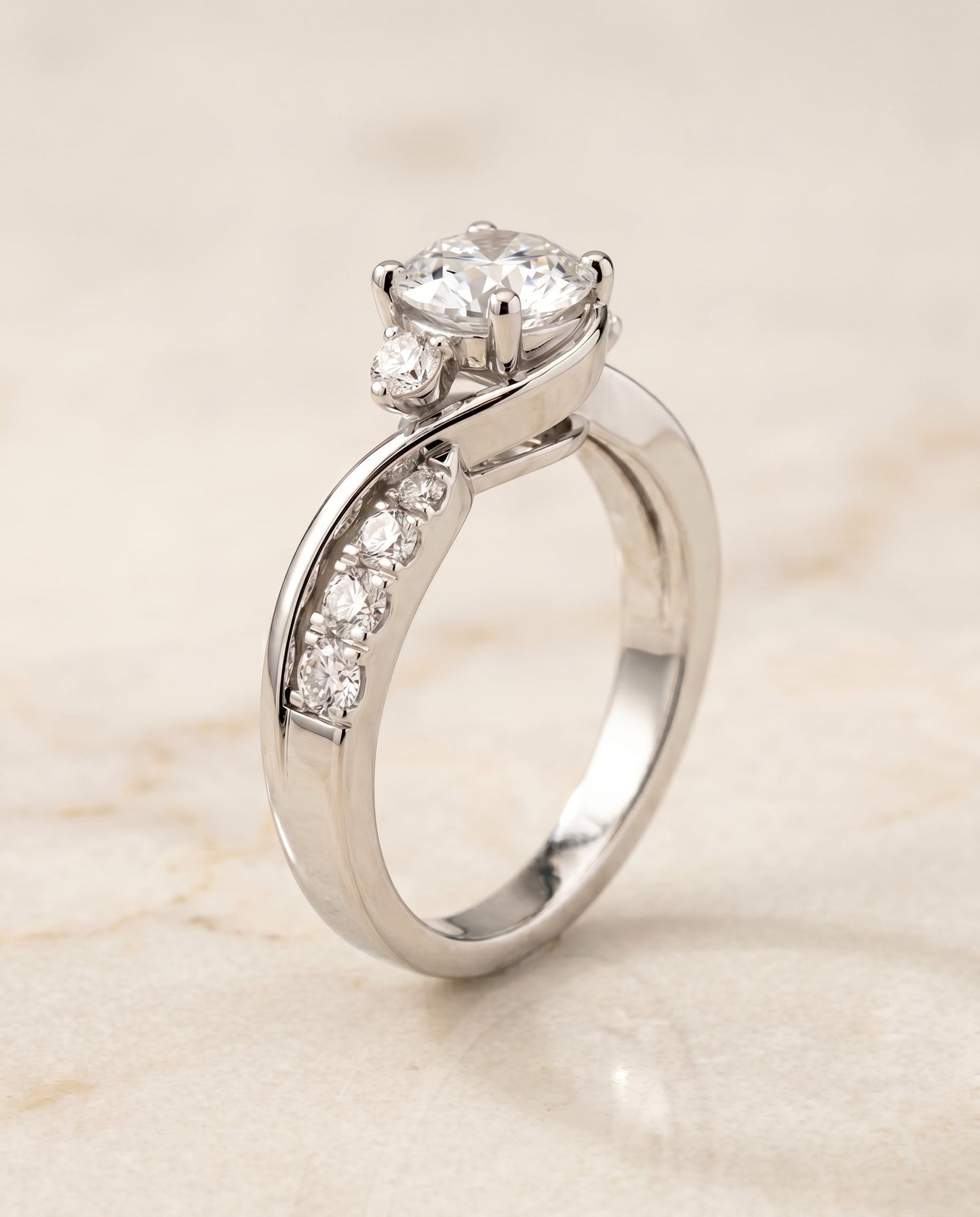 Round Brilliant, Twisted Three Stone, in 18K White Gold – front view | RockHer