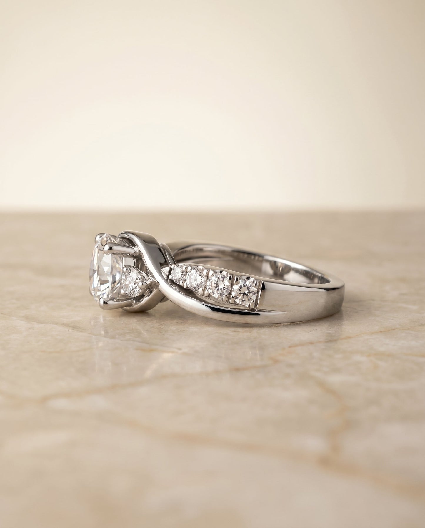 Round Brilliant, Twisted Three Stone, in 18K White Gold – side profile | RockHer