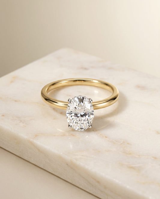The Eartha Hidden Halo Solitaire Engagement Ring Setting for Oval Diamonds in 18K Yellow Gold | RockHer