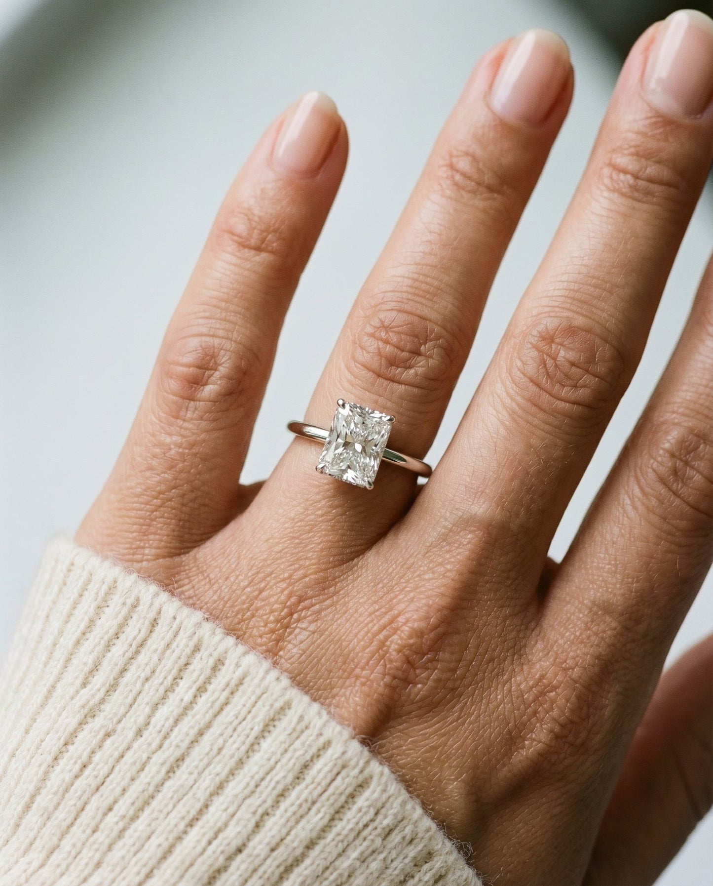Upper Hidden Halo Solitaire Radiant, in Platinum – lifestyle shot | RockHer