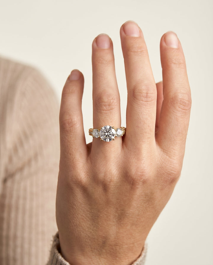 Round Brilliant, Vintage Scroll Three Stone, in 18K Yellow Gold, pave setting – lifestyle shot | RockHer